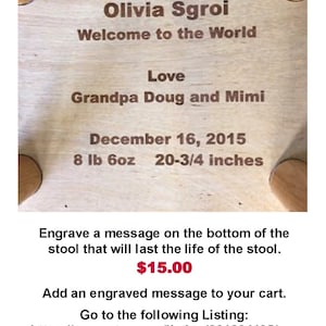 May include: A wooden stool with a personalized inscription for a baby girl named Olivia Sgroi. The inscription includes her birthdate, weight, and height. The stool is 20-3/4 inches tall and weighs 8 pounds 6 ounces. The inscription reads: "Olivia Sgroi Welcome to the World Love Grandpa Doug and Mimi December 16, 2015 8 lb 6oz 20-3/4 inches".