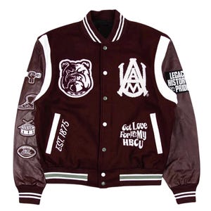 May include: A maroon and gray varsity jacket with white accents. Features a bulldog patch, the letters "A&M", and the text "Got Love For My HBCU". Includes patches with a fist, a shoe, a drum, and a football. The jacket has the text "Legacy History Pride" on the sleeve.