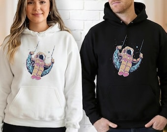 Astronaut Moon Swing Hoodie, Space Aesthetic Sweatshirt, Unisex Graphic Hoodie, Cosmic Astronaut Pullover, Galaxy Hoodie Gift