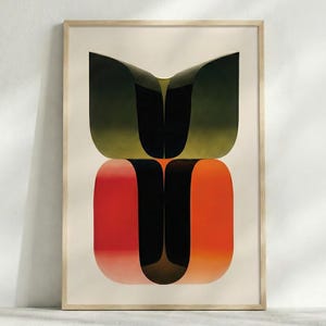 May include: Abstract art print in a wooden frame. The artwork features two stacked, rounded shapes. The top shape is green and black, while the bottom shape transitions from red to orange. The background is a light beige.