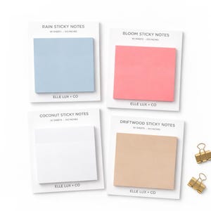 May include: Four sets of sticky notes in pastel colors: light blue, pink, white, and beige. Each pad is 3x3 inches and includes 50 sheets. The brand name "ELLE LUX + CO" is printed on each card. Two gold binder clips are in the bottom right corner.