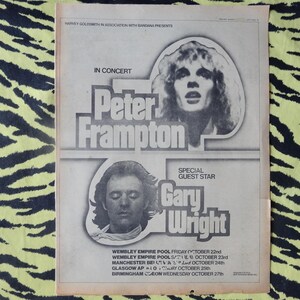 May include: Black and white concert poster advertising a Peter Frampton concert with special guest star Gary Wright. The poster lists concert dates and locations in October 1976, including Wembley Empire Pool, Manchester, Glasgow, and Birmingham.