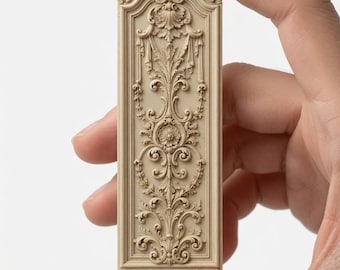 May include: A rectangular beige decorative panel featuring intricate relief carvings of acanthus leaves, floral motifs, and scrolling vines. The piece has a rounded top edge with a shell-like design and a flat base, showcasing detailed craftsmanship.