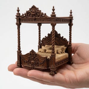 May include: A miniature four-poster bed featuring a dark brown frame with intricate carved detailing, including spiral columns and ornate headboard and footboard designs. The bed is dressed with gold-toned bedding, including a quilt and multiple pillows.