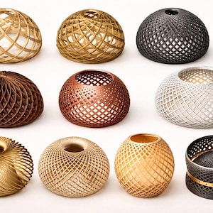 May include: A collection of eleven decorative objects with intricate lattice, mesh, and geometric patterns. The items are spherical, dome-shaped, or cylindrical, featuring metallic finishes in gold, bronze, silver, copper, and matte black colors.