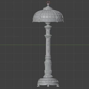 May include: A grey 3D digital model of a table lamp featuring a dome-shaped shade with a grid pattern and a decorative column base. The lamp has an ornate, textured surface with floral and geometric relief details throughout the structure.