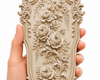 May include: A beige, vertically oriented, rectangular decorative plaque with an ornate, scalloped frame. The surface features a high-relief, three-dimensional sculpted arrangement of various blooming flowers, leafy stems, and intricate floral details.