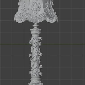 May include: A grey 3D digital model of a floor lamp featuring an ornate lampshade with fringe trim and a central column decorated with sculpted floral vines. The base is wide and detailed with intricate carvings, set against a dark grid background.