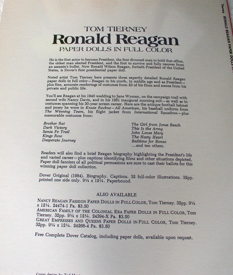 May include: A paperbound book titled Tom Tierney Ronald Reagan Paper Dolls in Full Color. The cover features black text on a cream background, detailing a 1984 Dover publication with 32 pages of illustrations measuring 9.25 inches by 12.25 inches.