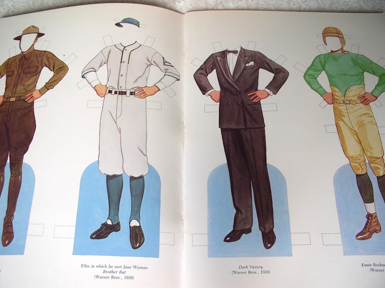 May include: A vintage paper doll set featuring four figures with blank faces. The outfits include a brown military uniform, a white baseball uniform with a cap, a dark double-breasted suit with a bowtie, and a green long-sleeve shirt with tan breeches.