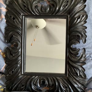 Black ornate rectangular mirror wall of mirrors Rococo style