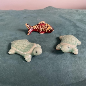 Set of three ceramic chopsticks rest two turtles and a fish