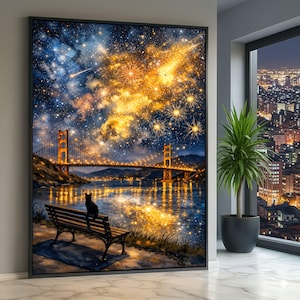 May include: A framed art print depicts the Golden Gate Bridge at night, with a starry sky and fireworks display. A black cat sits on a park bench overlooking the water. The artwork is displayed in a modern interior setting.