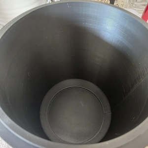 Top-down view inside gothic storage canister showing smooth cylindrical interior, flat reinforced base, and deep capacity for organizing bathroom, kitchen, office, or gothic decor items.