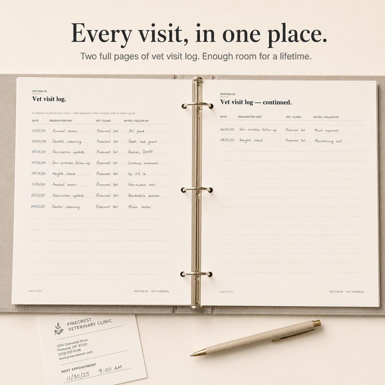 May include: Open notebook with two pages of vet visit logs, with the text "Every visit, in one place." A pen and a Pinecrest Veterinary Clinic business card are on the surface. The notebook is open to a spread of lined pages.
