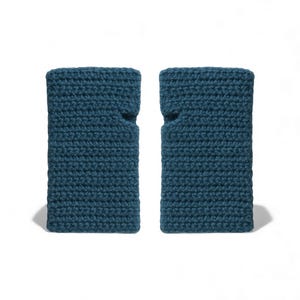 May include: Two teal blue crochet wrist cuffs are displayed against a white background. Each cuff has a rectangular shape with a thumb hole. The cuffs are made of a textured, knitted material.