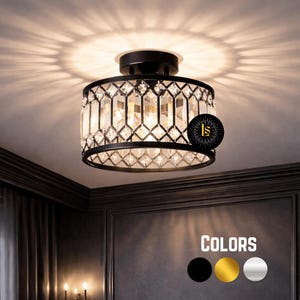 May include: A black, crystal-adorned ceiling light fixture. The light fixture has a circular design with a black metal frame and clear, geometric-shaped crystals. The light casts a pattern on the ceiling. The image also shows color options: black, gold, and silver.