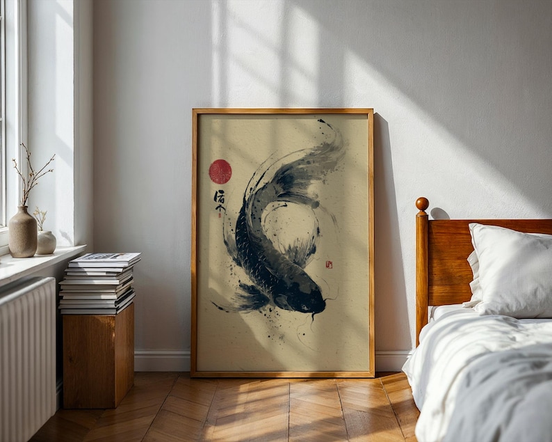 May include: Framed art print featuring a black and white koi fish illustration. The artwork has a minimalist style with Japanese calligraphy and a red sun. The print is displayed in a wooden frame, adding a touch of natural warmth to the room.