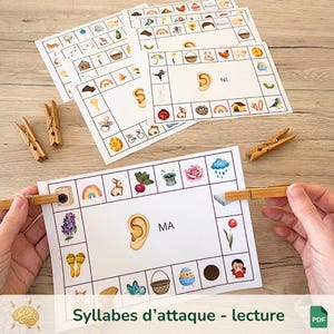 Può includere: Gioco educativo con carte illustrate e mollette di legno. Le carte presentano immagini colorate e il testo "MA" e "NI". Il gioco è progettato per l'alfabetizzazione precoce e la fonetica. Il testo "Syallbes d'attaque - lecture" è in basso.