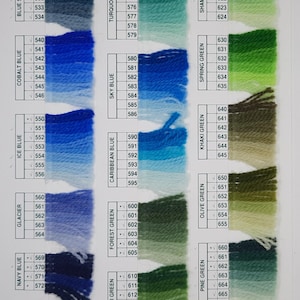May include: Color swatches of yarn in various shades of blue, green, and olive. The color names are listed next to each swatch, including Blue Spruce, Cobalt Blue, and Hunter Green. Each swatch has a corresponding number.