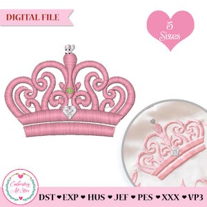 May include: A pink embroidered crown design with a heart-shaped jewel. The image includes the text "DIGITAL FILE" and "5 Sizes". The design is for embroidery and is available in multiple file formats.