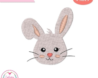 Puede incluir: Un archivo digital con un diseño de bordado de cara de conejo. El conejo tiene orejas grandes, ojos negros, bigotes y una nariz rosa. El diseño es en tonos de gris y rosa. El texto en la imagen dice "ARCHIVO DIGITAL" y "4 Tamaños".