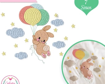 May include: Digital file featuring a brown bunny holding colorful balloons, surrounded by stars and clouds. The design includes the text "DIGITAL FILE" and "7 Sizes". The image is from Embroidery Art Store.
