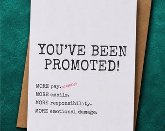 May include: A white greeting card with black typewriter-style text that reads: YOU'VE BEEN PROMOTED! MORE pay. (slightly) MORE emails. MORE responsibility. MORE emotional damage. The card is placed on top of a brown paper envelope.