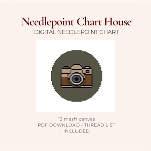 May include: A digital needlepoint chart from Needlepoint Chart House featuring a pixel art camera icon in brown and black on a dark olive green circular background. The text includes Needlepoint Chart House, 13 mesh canvas, and PDF download thread list.
