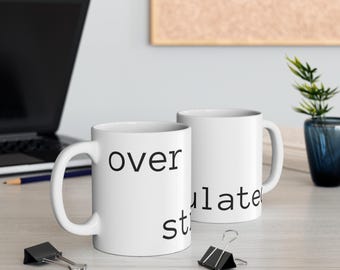 OVER STIMULATED wordmark Mug | 11oz ceramic coffee tea cup