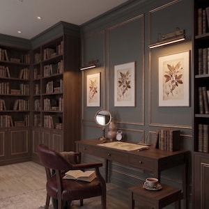 Classic gallery picture light installed above framed artwork in modern traditional interior.