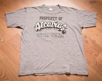 80s Property of Alcatraz Swim Team T-Shirt, L, Rayon Tri-Blend, Vintage Graphic Tee, Ball and Chain, Joke, Funny, Humor, Prison Escape