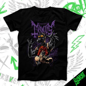 May include: Black t-shirt featuring a graphic design with the text "Psycho Mantis" in purple. The design includes a figure wearing a gas mask and a person with red hair holding a gun. The overall theme is dark and edgy.