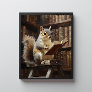 May include: A framed print depicts a squirrel reading a book in a library. The squirrel, with gray and brown fur, sits on a small wooden stool, engrossed in the open book. The background features a wall of antique books, creating a cozy, scholarly atmosphere.