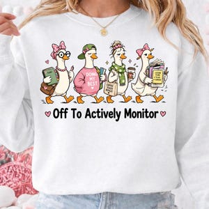 May include: A set of three ceramic mugs with a speckled, matte finish. The mugs are in shades of cream, light gray, and dark gray. Each mug has a simple, minimalist design, perfect for coffee or tea.