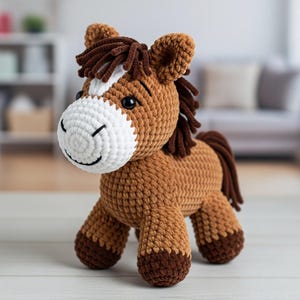 May include: A handmade crochet horse toy in shades of brown, white, and dark brown. The horse has a white muzzle, dark eyes, and a brown mane and tail. The toy is standing on four legs.