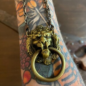 Lion door knocker necklace southern charm hotsell