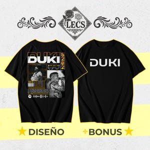 May include: Black t-shirts with the word "DUKI" in white. One shirt features a graphic design with the word "DUKI", images, and text. The other shirt has the word "DUKI" in large white letters. The shirts have a yellow star with the word "DISEÑO" and "BONUS".