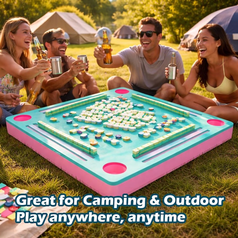 May include: A turquoise and pink Mahjong game set on a grassy surface. The game is surrounded by people holding drinks, with tents in the background. Text on the image reads: Great for Camping & Outdoor Play anywhere, anytime.