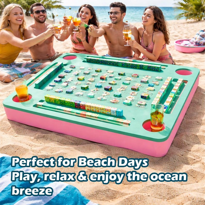 May include: A large, rectangular, teal and pink game board with colorful game pieces is set up on a sandy beach. The board has drink holders and is surrounded by people enjoying drinks. Text on the bottom reads: "Perfect for Beach Days Play, relax & enjoy the ocean breeze."