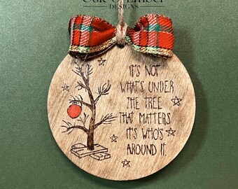 It’s not what’s under the tree that matters it’s who’s around it, wooden Christmas ornament with bow.