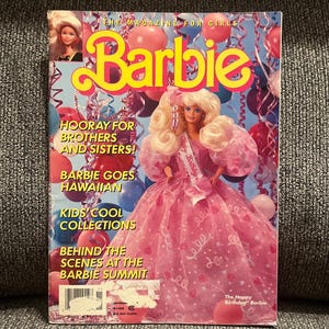 May include: A vintage Barbie magazine for girls featuring a blonde doll in a pink gown with a Happy Birthday sash. The cover displays text including Hooray for Brothers and Sisters, Barbie Goes Hawaiian, Kids' Cool Collections, and Behind the Scenes at the Barbie Summit, set against a background of colorful balloons and streamers.