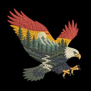 May include: Embroidered design of an eagle in flight, with a landscape scene within its wings. The wings feature a sunset gradient of red, yellow, and orange. The landscape includes mountains, trees, and a river, all on a black background.