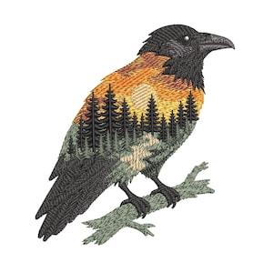 May include: Embroidered raven design featuring a sunset and forest scene. The raven is perched on a branch, with a black head and body. The raven's body features a sunset with a forest of trees.