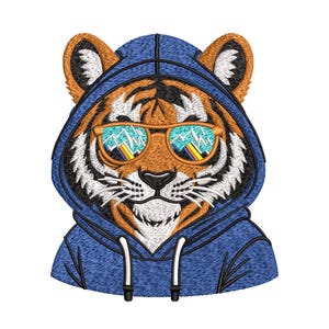 May include: Embroidered tiger wearing a blue hoodie and sunglasses. The tiger has orange and black fur, white whiskers, and a black nose. The sunglasses reflect a mountain scene.