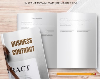 Può includere: Un contratto commerciale con le parole "BUSINESS CONTRACT" in grandi lettere marroni sulla copertina. Il contratto è aperto per rivelare pagine vuote con le parole "SALES CONTRACT" e "SPECIAL CLAUSE". Una matita poggia sulla superficie di legno.