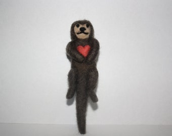 small needle felted otter with heart