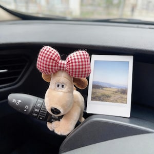 May include: A set of three ceramic mugs with a speckled, matte finish. The mugs are in shades of cream, light brown, and dark brown. Each mug has a simple, minimalist design, perfect for coffee or tea.