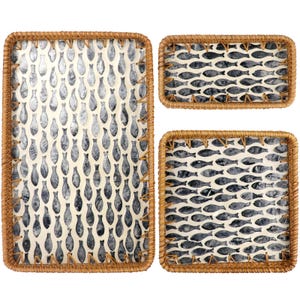 May include: Three rectangular woven trays with a fish pattern. The trays have a natural brown woven border and a cream-colored interior with a repeating pattern of gray fish. The largest tray is square, and the other two are rectangular.