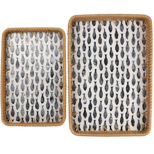 May include: Two rectangular woven trays with a fish pattern. The trays have a natural brown border and a white background with a repeating pattern of dark blue fish. The trays are different sizes.